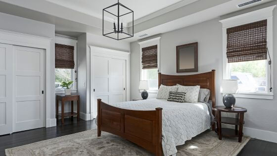 Bedroom with white bedding and dark furniture