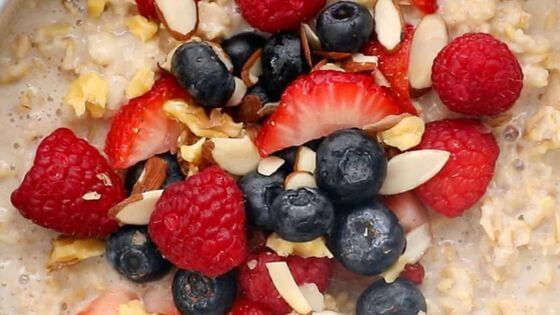 Air Fryer oatmeal with strawberries and blueberries on top