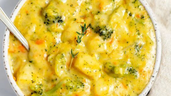 potato broccoli cheddar soup in white bowl