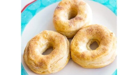 air fryer cinnamon sugar donuts on white blue and red plate