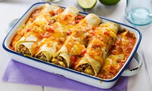 beef enchiladas in white dish