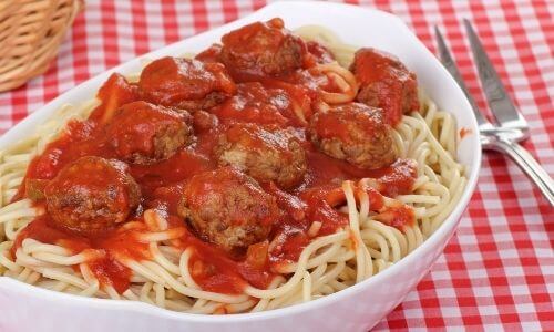 spaghetti and ground beef meatballs in white dish