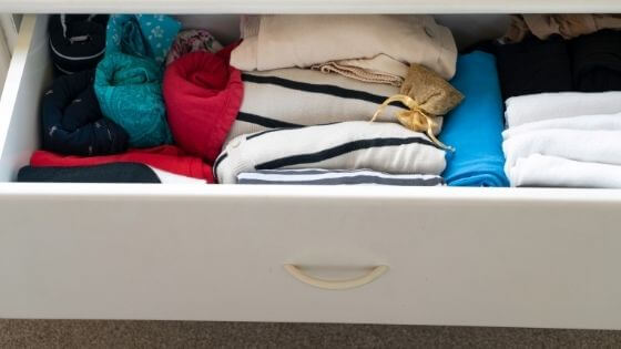 white drawer with clothes