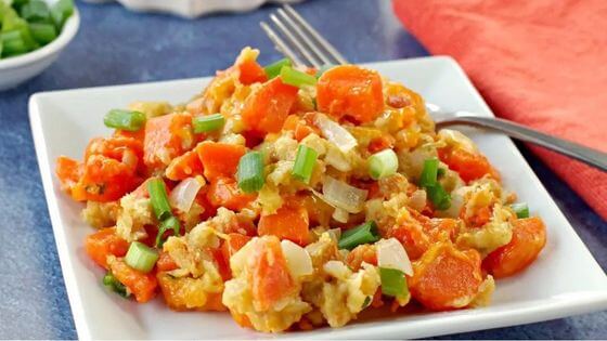 Carrot casserole with stuffing on white square plate