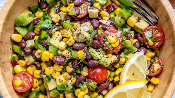 Salad with beans, corn, tomatoes in Italian dressing