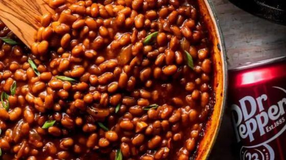 Baked beans made with Dr. Pepper in brown bowl