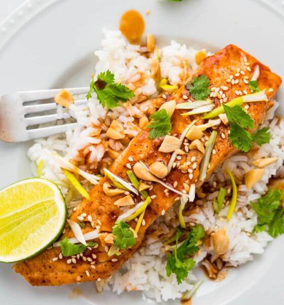 Glazed Salmon with White Rice on White Plate with Lemon Wedge