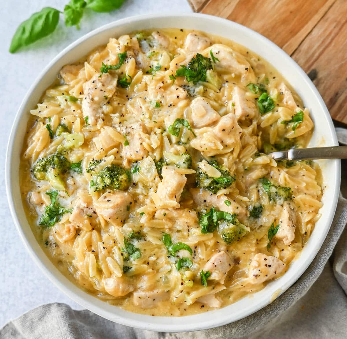 One pot chicken and broccoli orzo in white bowl