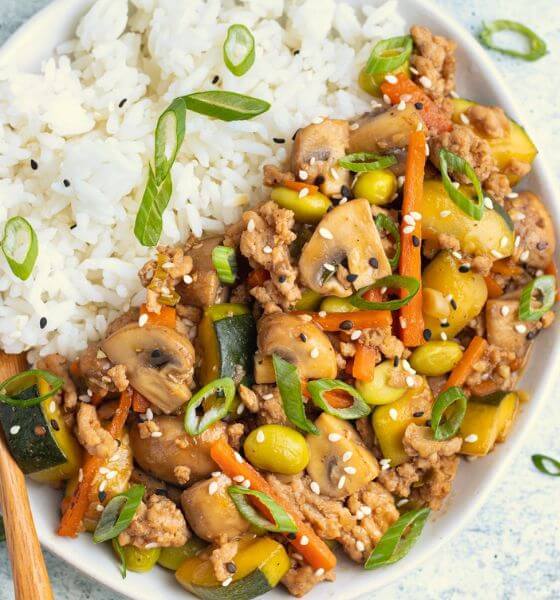 Ground Chicken Stir fry with rice on white plate