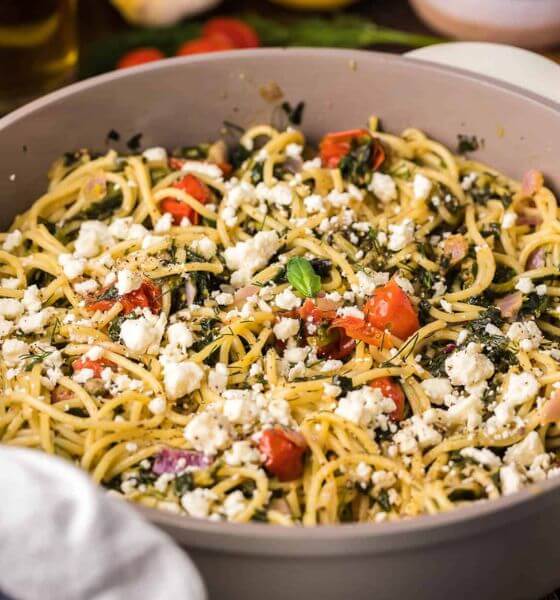 Greek Spaghetti in Grey Bowl with Feta and Tomatoes