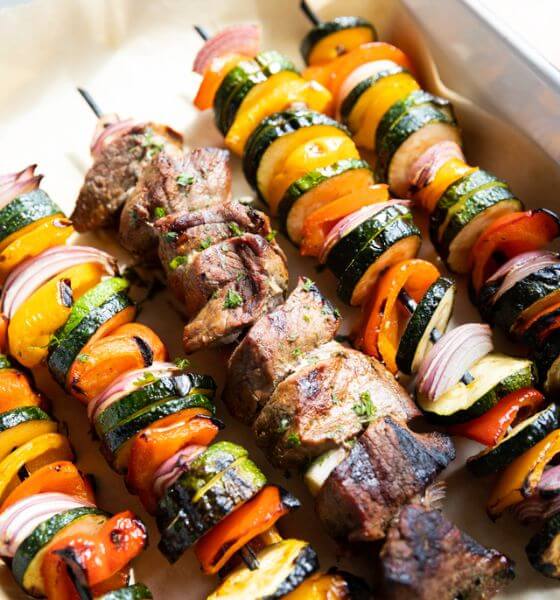Steak Kabobs and Vegetable Kabobs on white platter