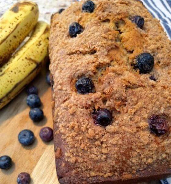 Blueberry banana bread with blueberries and bananas on the side