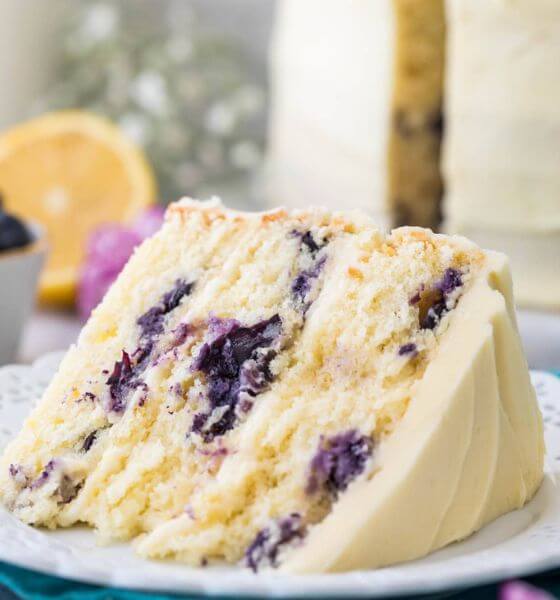 Slice of Lemon Blueberry cake on white plate