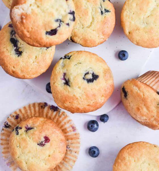 Lemon and blueberry muffins on white background