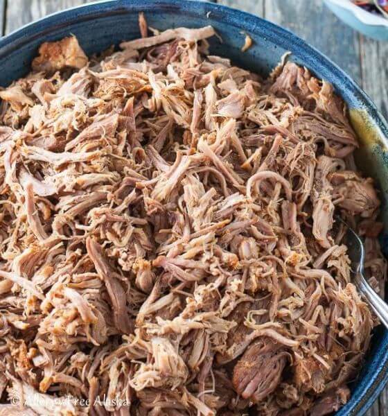 Pulled pork in blue dish for potluck