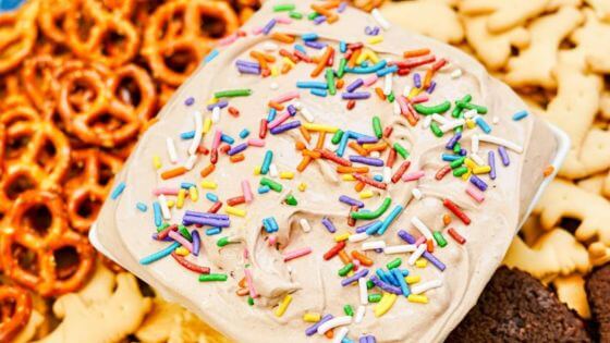 Brownie batter dip with crackers and pretzels on the side