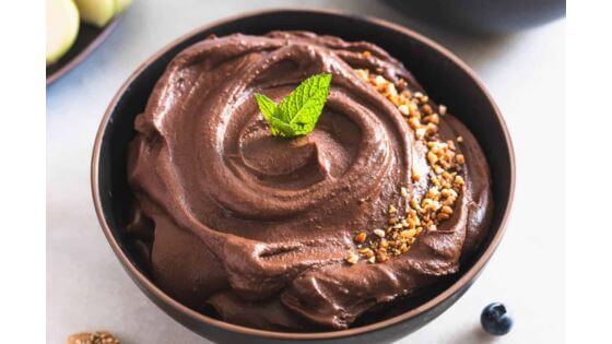 Dark chocolate hummus in brown bowl