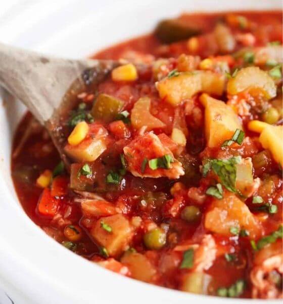 Chicken and vegetable soup in white bowl