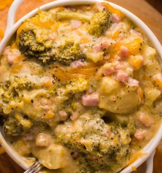 cheddar broccoli and ham soup in white bowl