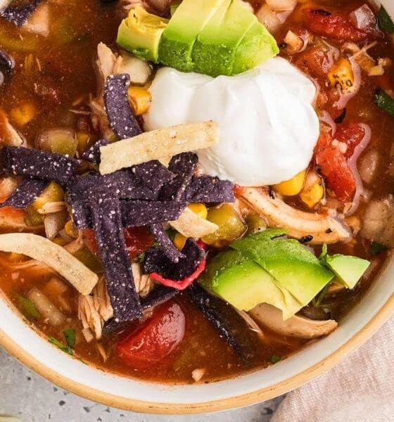 tortilla soup in tan bowl
