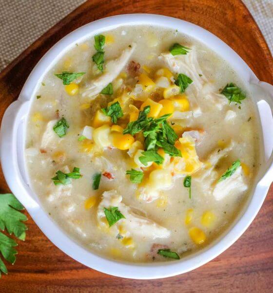 Crockpot corn chowder with chicken in white bowl