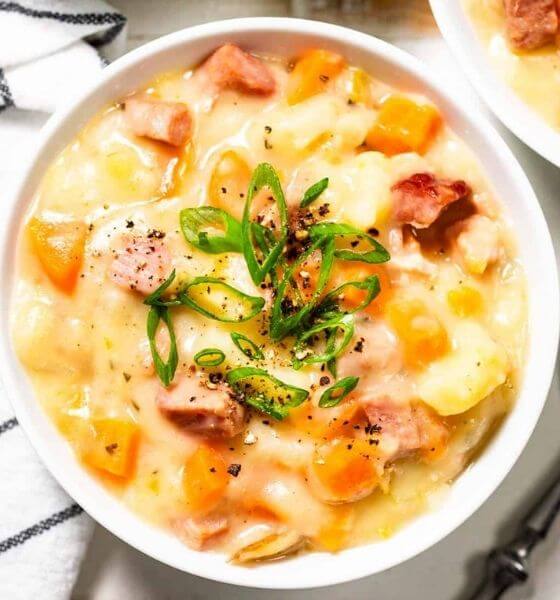 ham and potato soup in white bowl