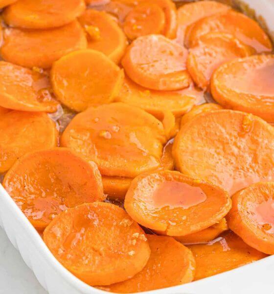 Candied Sweet potatoes in white baking dish
