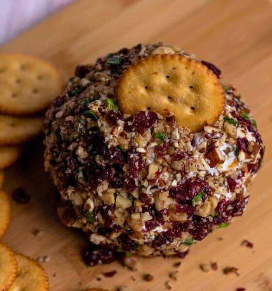 Cranberry cheeseball on wood cutting board