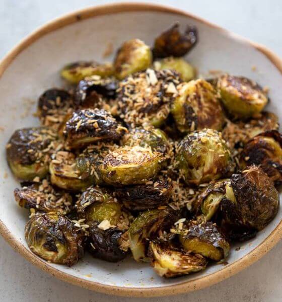 Maple glazed brussels sprouts on white plate