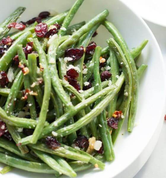 Green Beans and bacon on white plate