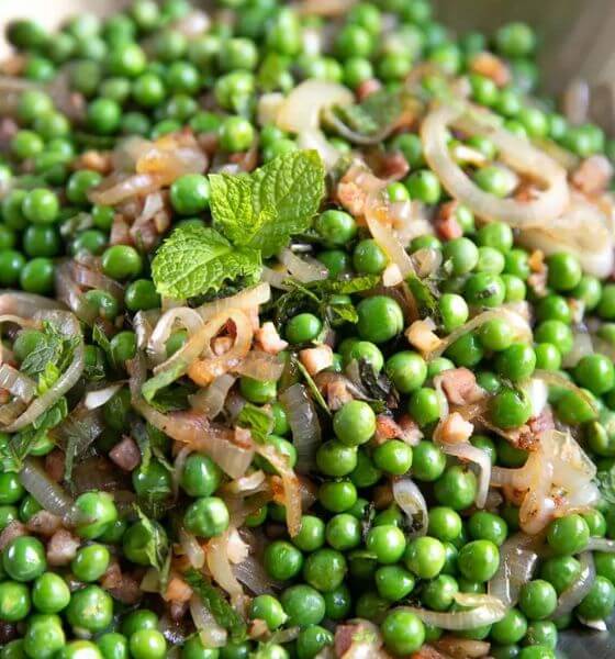 Peas and pancetta on plate