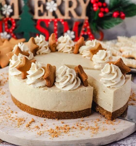 Gingerbread cheesecake with gingerbread stars and whipped cream on top 