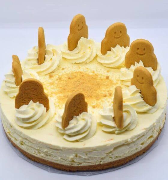Gingerbread orange cheesecake with gingerbread and whipped cream on top