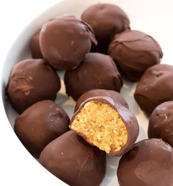 Chocolate dipped pretzel truffles in white bowl