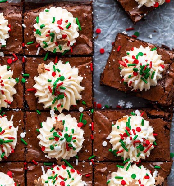 Gingerbread Christmas brownies with white frosting on top with red, green and white sprinkles