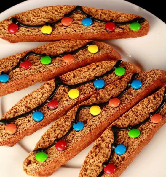 Gingerbread biscotti with M&M's on white plate