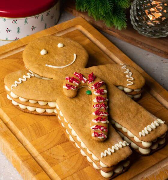 Homemade Gingerbread man on wood cutting board