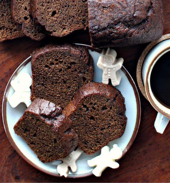 Gingerbread loaf cake on a white and brown striped plate