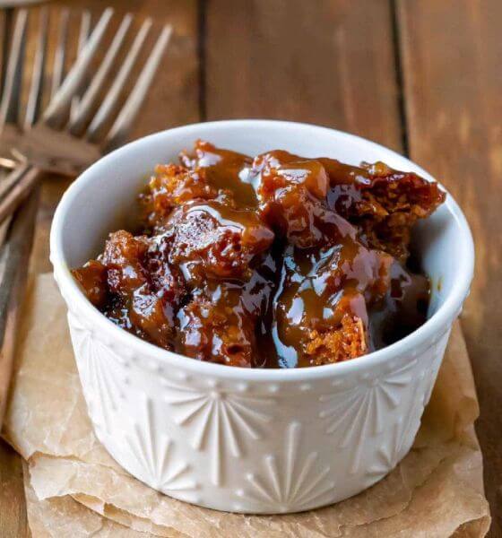 Gingerbread pudding cake in white bowl