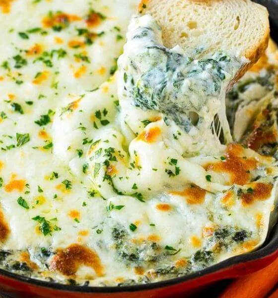 Cheesy spinach dip in skillet
