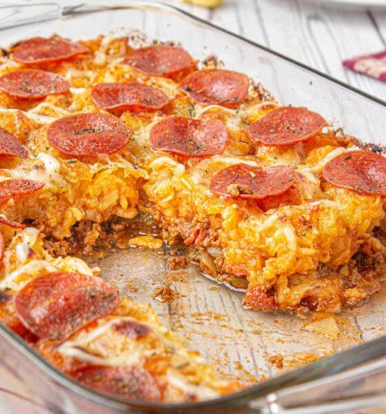 Pizza tater tot casserole in glass baking dish