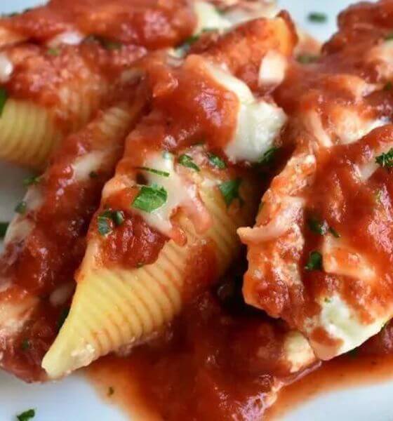 Stuffed shells casserole on white dish