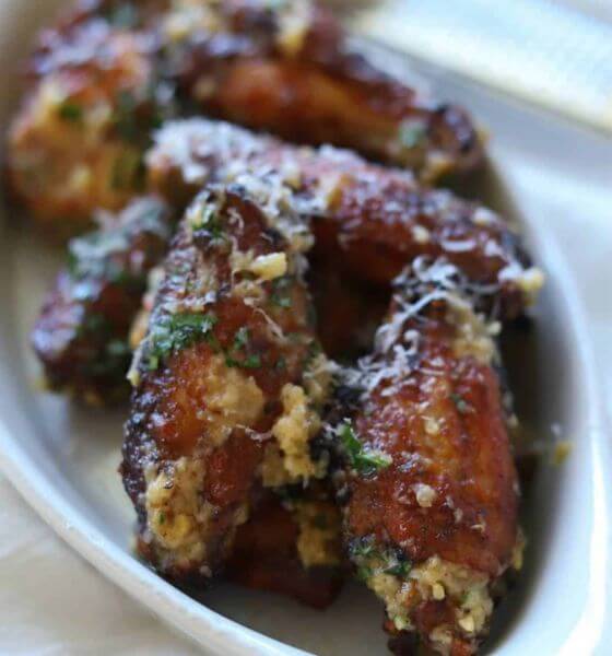 Garlic parmesan chicken wings on white plate