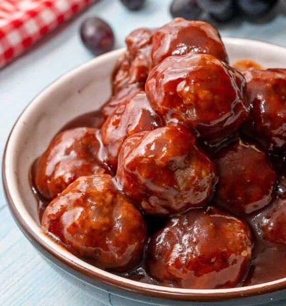Grape jelly bbq meatballs on white plate