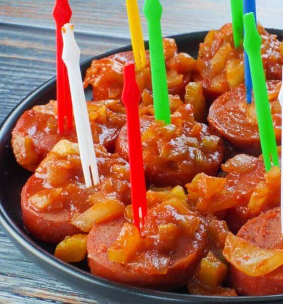 Kielbasa appetizer on a black plate