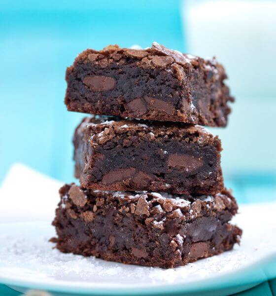 Fudgy brownies on white plate