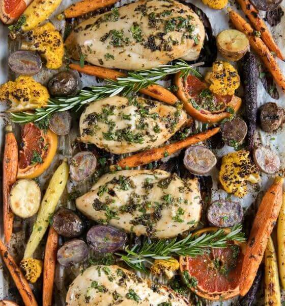 Grapefruit, roasted vegetables and chicken on a sheet pan