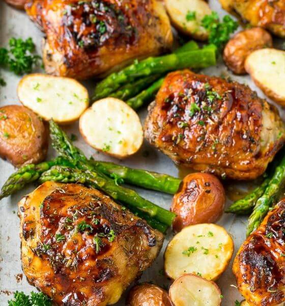 Balsamic chicken, potatoes and vegetables on a baking sheet