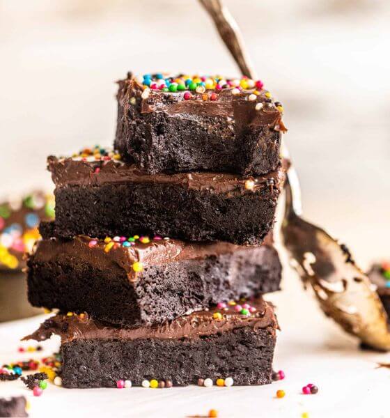 Homemade cosmic brownies with a gold spoon