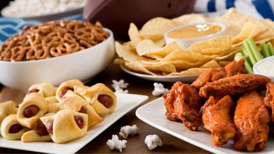 Chicken wings, popcorn, pretzels, party dip and chip game day appetizers
